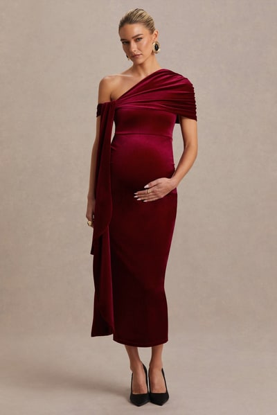 Club L London Zena | Burgundy Velvet Asymmetric-Neck Maternity Midi Dress With Knot And Sash Detail