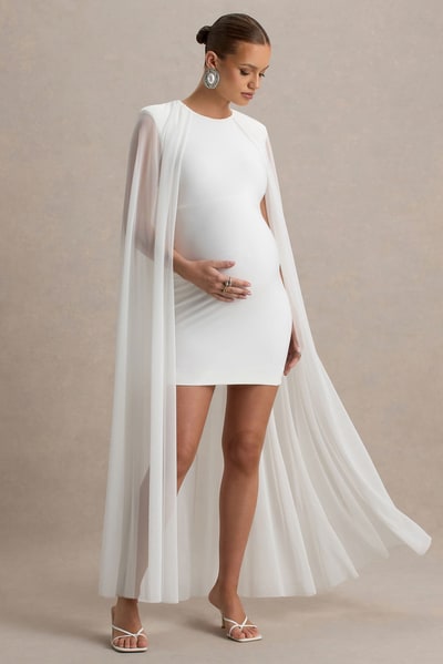 Club L London Charlene | White High-Neck Maternity Mini Dress With Mesh Cape